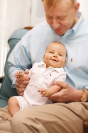 Dr. Mark Mitchell Jones holding baby